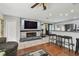 Stylish living area with modern fireplace, TV, and an open floor plan to the dining area at 8431 52Nd N Way, Pinellas Park, FL 33781