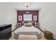 Main bedroom featuring a unique bed, accent wall, and neutral decor at 8431 52Nd N Way, Pinellas Park, FL 33781