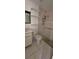 Standard bathroom featuring tile floors, shower, toilet, and a vanity with mirror at 8623 Stonehedge Way, Hudson, FL 34667