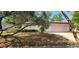 Charming single-story home with a well-maintained front yard and a two car garage, offering curb appeal at 8623 Stonehedge Way, Hudson, FL 34667