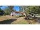 Charming single-story home with a well-maintained front yard and a two car garage, offering curb appeal at 8623 Stonehedge Way, Hudson, FL 34667