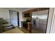 A bright kitchen features stainless steel appliances, wood countertops, and wood floors at 8623 Stonehedge Way, Hudson, FL 34667