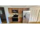 A bright kitchen features stainless steel appliances and plenty of cabinet space at 8623 Stonehedge Way, Hudson, FL 34667