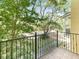 Outdoor balcony shows nice nature views and is surrounded by mature trees and lush green foliage at 956 Sombra St, Tampa, FL 33619