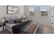Cozy bedroom features lots of natural light, neutral walls, and is furnished with comfortable bedding at 956 Sombra St, Tampa, FL 33619