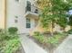 Charming townhouse exterior with a private balcony overlooking a well-maintained landscape and a welcoming entrance at 956 Sombra St, Tampa, FL 33619