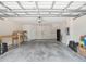 Spacious two car garage with ample storage space and a secure garage door at 956 Sombra St, Tampa, FL 33619