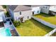 Spacious backyard with a privacy fence, patio area, and lush lawn, creating an ideal outdoor living space at 9617 Channing Hill Dr Dr, Ruskin, FL 33573