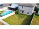 Enjoy this backyard featuring a pool, screen-enclosed patio, and privacy fence, perfect for outdoor relaxation and entertaining at 9617 Channing Hill Dr Dr, Ruskin, FL 33573