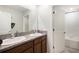 Double sink bathroom vanity with granite countertop and dark wood cabinets at 9617 Channing Hill Dr Dr, Ruskin, FL 33573