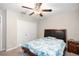 Bedroom featuring a ceiling fan, closet, and a nightstand at 9617 Channing Hill Dr Dr, Ruskin, FL 33573