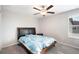 Bedroom with a ceiling fan, closet, and dresser at 9617 Channing Hill Dr Dr, Ruskin, FL 33573