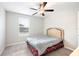 Cozy bedroom with a ceiling fan and a bright window that lets in plenty of natural light at 9617 Channing Hill Dr Dr, Ruskin, FL 33573