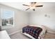 Bedroom with a window, carpet flooring, and a ceiling fan at 9617 Channing Hill Dr Dr, Ruskin, FL 33573