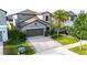 Charming two-story home with a two car garage, beautiful landscaping, and a well-manicured lawn at 9617 Channing Hill Dr Dr, Ruskin, FL 33573