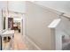 Bright hallway with tile floors and white walls, offering a glimpse into the living areas at 9617 Channing Hill Dr Dr, Ruskin, FL 33573