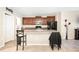Inviting kitchen with a center island, dark wood cabinets, and stainless steel appliances at 9617 Channing Hill Dr Dr, Ruskin, FL 33573