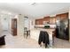Spacious kitchen with a large center island, dark wood cabinets, and modern appliances at 9617 Channing Hill Dr Dr, Ruskin, FL 33573