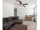Open living room featuring a comfortable sofa and natural light at 9617 Channing Hill Dr Dr, Ruskin, FL 33573