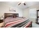 Bright and spacious bedroom with nice furnishings and a ceiling fan at 9617 Channing Hill Dr Dr, Ruskin, FL 33573