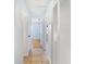 Hallway features tile floors, linen closet, and bright white walls at 1021 Apollo Beach Blvd # 6, Apollo Beach, FL 33572