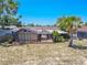 Overhead view of home with covered patio and lush backyard at 1034 Mandarin Dr, Holiday, FL 34691
