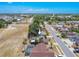 Aerial shot of the house with screened patios in a suburban community at 1034 Mandarin Dr, Holiday, FL 34691
