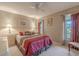 Inviting bedroom with large windows, soft lighting, and carpeted floors at 1034 Mandarin Dr, Holiday, FL 34691