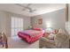 Bright bedroom with a sofa, closet, and access to natural light, perfect for relaxation at 1034 Mandarin Dr, Holiday, FL 34691