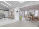 Open dining area with a view of the lanai that seamlessly connects indoor and outdoor living spaces at 1034 Mandarin Dr, Holiday, FL 34691