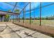 Screened-in patio with a view of the yard and surroundings at 1034 Mandarin Dr, Holiday, FL 34691