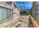Wide view of screened in patio with sliding glass door at 1034 Mandarin Dr, Holiday, FL 34691