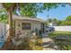 Backyard featuring a cozy outdoor dining area, lush greenery, and a private setting at 1050 22Nd N Ave, St Petersburg, FL 33704