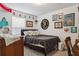 Cozy bedroom with decorative wall art and ample natural light from the window at 1050 22Nd N Ave, St Petersburg, FL 33704