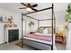 Bright bedroom with canopy bed, neutral decor, and natural light from the windows at 1050 22Nd N Ave, St Petersburg, FL 33704