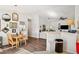 Open-concept dining room with modern decor and wood flooring, illuminated by natural light at 1050 22Nd N Ave, St Petersburg, FL 33704