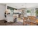 Open concept view of the kitchen, dining area, and back patio in this home at 1050 22Nd N Ave, St Petersburg, FL 33704