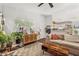 Bright living room with a cozy sectional, stylish rug, and view into the kitchen at 1050 22Nd N Ave, St Petersburg, FL 33704