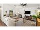 Spacious living room featuring a comfortable sectional sofa and modern entertainment center at 1050 22Nd N Ave, St Petersburg, FL 33704