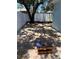 A spacious backyard with a brick patio, lush tree providing shade and area for recreation and outdoor enjoyment at 110 Kenwood Ave, Clearwater, FL 33755