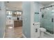 Modern bathroom with a sleek glass shower, contemporary fixtures, and bright lighting offering a spa-like experience at 110 Kenwood Ave, Clearwater, FL 33755