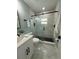 Chic bathroom with a glass-enclosed shower, elegant tiling, and modern vanity creating a luxurious space at 110 Kenwood Ave, Clearwater, FL 33755