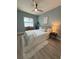 Serene bedroom featuring soft textures, natural light, and minimalist decor for a tranquil retreat at 110 Kenwood Ave, Clearwater, FL 33755