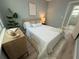 Well-lit bedroom with a cozy bed, stylish accents, and modern design creating a comfortable sanctuary at 110 Kenwood Ave, Clearwater, FL 33755