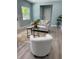 Relaxing living room setup with a plush sofa, accent chairs, and modern decor enhancing the inviting atmosphere at 110 Kenwood Ave, Clearwater, FL 33755