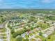 A captivating aerial shot shows this home nestled within a serene neighborhood surrounded by lush landscapes at 11218 Sun Tree Rd, Hudson, FL 34667