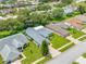 A pristine, picturesque home showcasing lush greenery and beautiful landscaping from an aerial view at 11218 Sun Tree Rd, Hudson, FL 34667