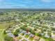 A captivating aerial shot shows this home nestled within a serene neighborhood surrounded by lush landscapes at 11218 Sun Tree Rd, Hudson, FL 34667