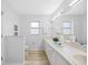Bright bathroom features double sinks, ample counter space, and modern fixtures at 11218 Sun Tree Rd, Hudson, FL 34667