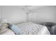 Comfortable bedroom featuring a plush bed, a sitting area, and carpeted floors for a cozy retreat at 11218 Sun Tree Rd, Hudson, FL 34667